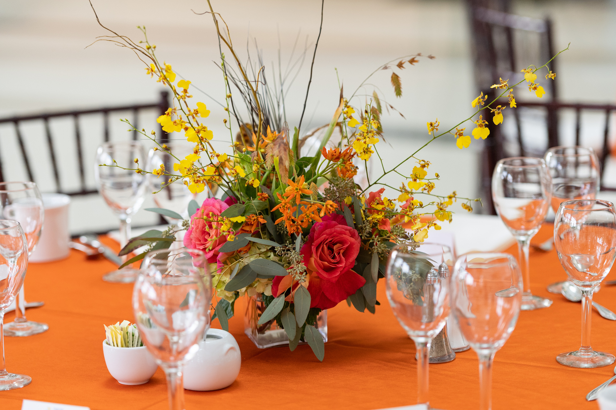 floral decoration on event reception table event planning ann arbor event management ann arbor conference planning ann arbor conference management ann arbor
